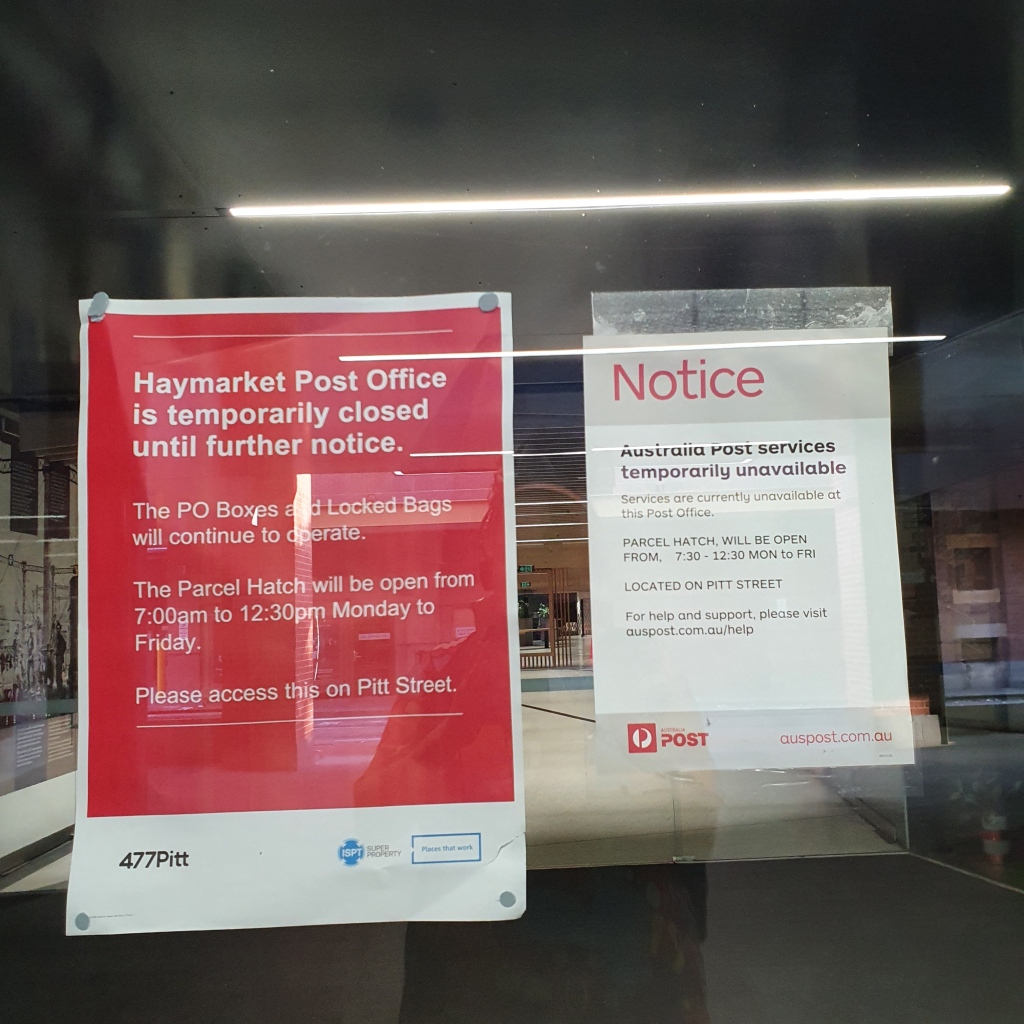 Two posters on a glass door. The signs say Haymarket Post Office is temporarily closed until further notices and that a parcel hatch will be open 7.30am-12.30pm Monday to Friday