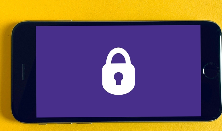 A mobile phone with a padlock symbol in the centre of the screen