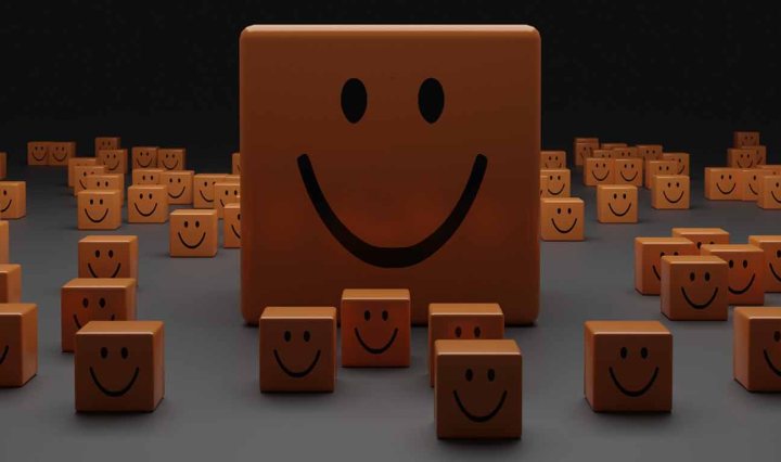 Many small blocks of wood, with one large wood rectangle in the centre. They all have a smiley face drawn on them